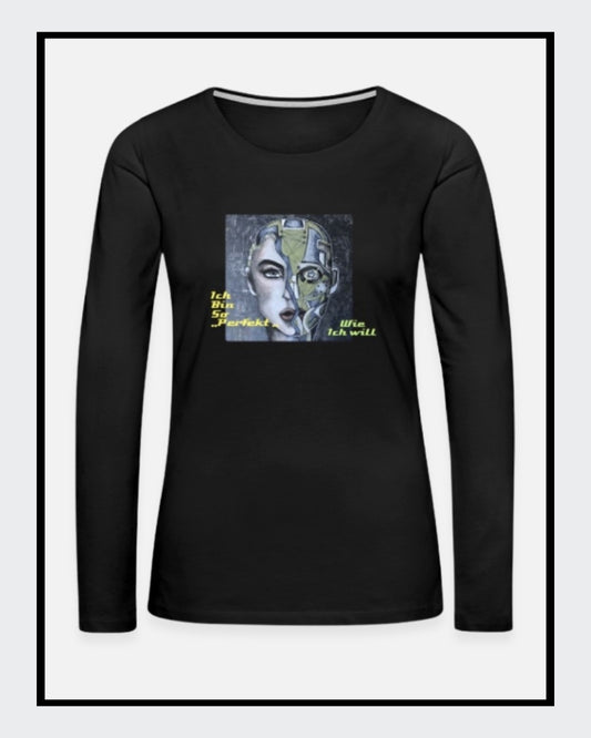 Ein schwarzes Langarmshirt mit einem Kunstwerk auf der Vorderseite. Das Motiv zeigt ein stilisiertes Gesicht, halb menschlich, halb futuristisch, mit der gelb-grünen Botschaft „Ich bin so 'PERFEKT' wie ich will“. Mode von "Soulfashion Lyrikherz & Springer" - erhältlich bei FEMARTSPACE - Artshop.