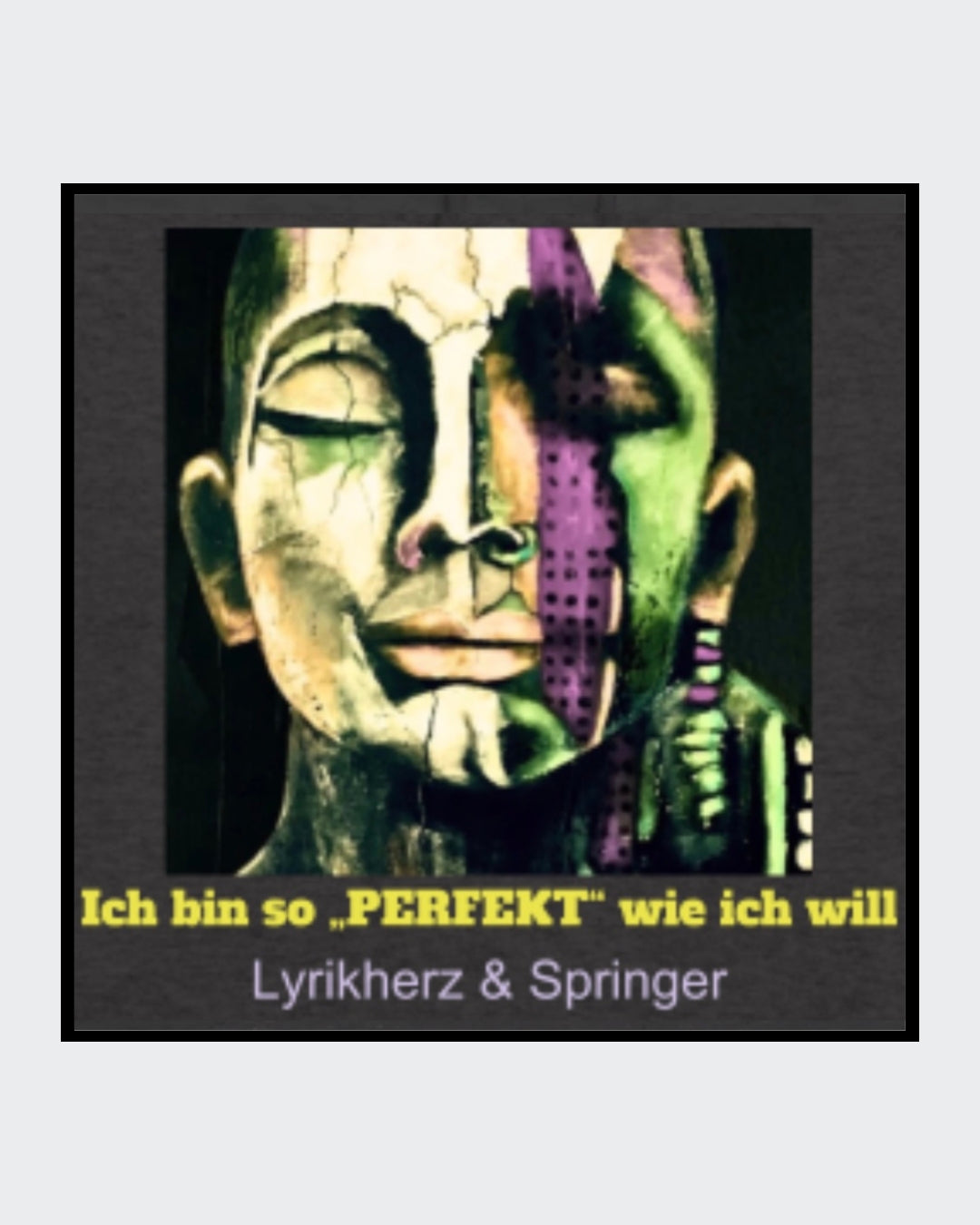 Ein anthrazitfarbener Unisex-Hoodie mit Kängurutasche und Kapuze. Auf der Vorderseite ist ein Kunstwerk gedruckt: Es zeigt ein abstrakt gestaltetes Gesicht, das halb modern, halb klassisch wirkt. Darunter steht der gelbe Schriftzug „Ich bin so 'PERFEKT' wie ich will“, ergänzt durch den Text Lyrikherz & Springer. Erhältlich bei FEMARTSPACE.
