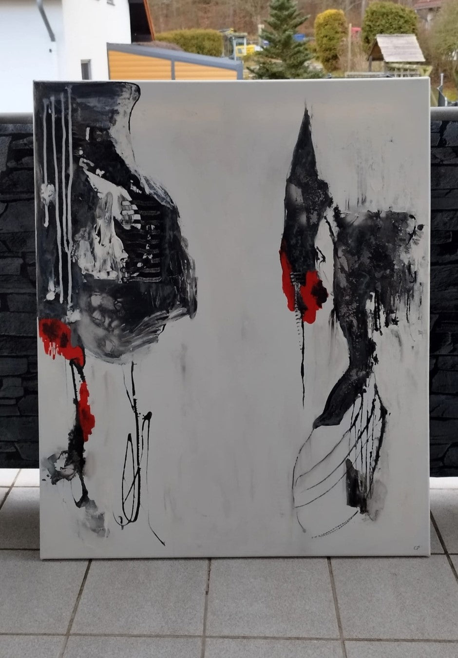 Abstraktes Gemälde "Bewegung in Schwarz und Rot" von Olga Kühn (100x80 cm). Minimalistische Mischtechnik auf Leinwand mit starken Kontrasten.